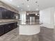 Modern kitchen with dark cabinetry, granite counters and island at 2364 Boretto St, Henderson, NV 89044