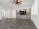 Living room with stone accent wall and built-in entertainment center at 2364 Boretto St, Henderson, NV 89044