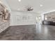 Open living space with stone feature wall and ceiling fan at 2364 Boretto St, Henderson, NV 89044