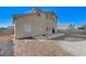 House exterior and backyard with patio and gravel at 2526 Rocky Countryside St, North Las Vegas, NV 89030