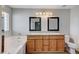 Bathroom with double vanity, granite countertop, and bathtub at 2526 Rocky Countryside St, North Las Vegas, NV 89030