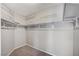 Spacious walk-in closet with built-in shelving and hanging rods at 2526 Rocky Countryside St, North Las Vegas, NV 89030