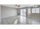 Open Gathering room with tile floors and sliding glass doors at 2526 Rocky Countryside St, North Las Vegas, NV 89030