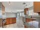 Kitchen with granite countertops and wood cabinets at 2526 Rocky Countryside St, North Las Vegas, NV 89030