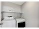 Laundry room with washer, dryer, and shelving at 2526 Rocky Countryside St, North Las Vegas, NV 89030