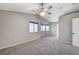 Large main bedroom with vaulted ceiling, ceiling fan, and carpet at 2526 Rocky Countryside St, North Las Vegas, NV 89030