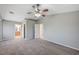 Spacious main bedroom with carpet, ceiling fan and ensuite bathroom at 2526 Rocky Countryside St, North Las Vegas, NV 89030