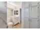 Bathroom with marble tile, vanity, and linen closet at 2633 S Durango Dr # 201, Las Vegas, NV 89117