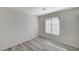 Simple bedroom with wood-look floors and a window at 2633 S Durango Dr # 201, Las Vegas, NV 89117