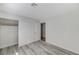 Well-lit bedroom with wood-look floors and a large closet at 2633 S Durango Dr # 201, Las Vegas, NV 89117