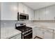 Modern kitchen with stainless steel appliances and white cabinets at 2633 S Durango Dr # 201, Las Vegas, NV 89117