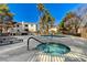 Community pool and spa with lounge chairs and landscaping at 2633 S Durango Dr # 201, Las Vegas, NV 89117