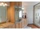 Bathroom with a large walk-in shower, granite countertop vanity, and lots of mirrors at 3008 Blue Fin Cir, Las Vegas, NV 89128