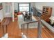 Open-concept dining area with natural light, fireplace, and wood flooring at 3008 Blue Fin Cir, Las Vegas, NV 89128