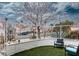 Cozy patio area with artificial turf, wrought iron fence, and seating, perfect for relaxing outdoors at 3008 Blue Fin Cir, Las Vegas, NV 89128