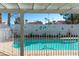 Backyard view of the pool, colorful murals on the fence and covered patio at 3008 Blue Fin Cir, Las Vegas, NV 89128