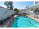 Inviting pool and patio area, featuring colorful wall murals, and shade structure at 3008 Blue Fin Cir, Las Vegas, NV 89128