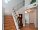 Well-lit staircase with wooden steps and stainless steel railing leading to the upper level at 3008 Blue Fin Cir, Las Vegas, NV 89128