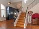 Modern staircase with wood steps and metal railing leading to upper level at 3008 Blue Fin Cir, Las Vegas, NV 89128