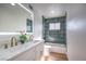 Spa-like bathroom with a freestanding tub, double vanity, and green tile at 3012 Holly Hill Ave, Las Vegas, NV 89104