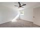 Bedroom featuring neutral carpet, a modern ceiling fan, and ample natural light from the window at 3012 Holly Hill Ave, Las Vegas, NV 89104