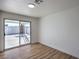 Bedroom featuring wood-look flooring and sliding glass doors that fill the room with light at 3012 Holly Hill Ave, Las Vegas, NV 89104