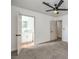 Bedroom featuring neutral carpet, natural light, and access to an ensuite bathroom at 3012 Holly Hill Ave, Las Vegas, NV 89104