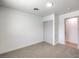 Bedroom featuring neutral carpet, a closet, and a view of the entrance to another room at 3012 Holly Hill Ave, Las Vegas, NV 89104