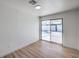 Bedroom featuring wood-look flooring, sliding glass doors with a view of the pool area at 3012 Holly Hill Ave, Las Vegas, NV 89104