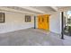 Bright and welcoming entry with a yellow front door and covered carport at 3012 Holly Hill Ave, Las Vegas, NV 89104