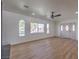 Living room featuring hardwood floors, ceiling fan and sliding door at 3012 Holly Hill Ave, Las Vegas, NV 89104