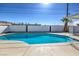 Sparkling pool with concrete surround offers a refreshing escape in this backyard oasis at 3012 Holly Hill Ave, Las Vegas, NV 89104