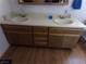 Double sink bathroom vanity with wood cabinets at 3381 W Simkins Rd, Pahrump, NV 89060