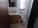 Small bathroom with single vanity and toilet at 3381 W Simkins Rd, Pahrump, NV 89060