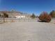 Gravel driveway and fenced yard at 3381 W Simkins Rd, Pahrump, NV 89060