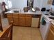 Kitchen island with wood cabinets and white appliances at 3381 W Simkins Rd, Pahrump, NV 89060