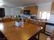 Dining area and kitchen with wood cabinets and appliances at 3381 W Simkins Rd, Pahrump, NV 89060