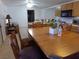 Dining area with wood table and chairs, adjacent to kitchen at 3381 W Simkins Rd, Pahrump, NV 89060