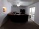 Comfortable living room with sectional sofa and sliding glass doors at 3381 W Simkins Rd, Pahrump, NV 89060