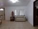 Cozy living room featuring a sofa and tiled floor at 3381 W Simkins Rd, Pahrump, NV 89060