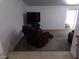 Living room with recliner chair and large TV at 3381 W Simkins Rd, Pahrump, NV 89060