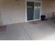 Covered patio with sliding glass door access for outdoor relaxation and enjoyment. Concrete slab surface at 3381 W Simkins Rd, Pahrump, NV 89060