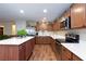 Spacious kitchen with island, stainless steel appliances, and wood cabinets at 3811 E Chaffe Ave, Pahrump, NV 89061