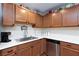 Kitchen with stainless steel sink and ample wood cabinets at 3811 E Chaffe Ave, Pahrump, NV 89061