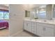 Bathroom with double vanity and a large mirror at 4390 E Cactus Canyon Dr, Pahrump, NV 89061