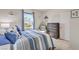 Spacious bedroom with striped bedding and ample closet space at 4390 E Cactus Canyon Dr, Pahrump, NV 89061