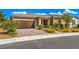 House exterior with brown garage door and brick driveway at 4390 E Cactus Canyon Dr, Pahrump, NV 89061