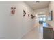 Hallway with gray console table and decorative wall masks at 4390 E Cactus Canyon Dr, Pahrump, NV 89061