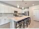 Modern kitchen featuring white cabinets, quartz countertops, and island with seating at 4390 E Cactus Canyon Dr, Pahrump, NV 89061