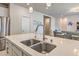 Kitchen island with double sink and modern faucet, stainless steel appliances at 4390 E Cactus Canyon Dr, Pahrump, NV 89061